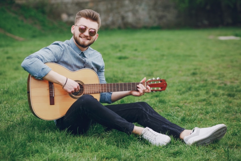 A man playing the guitar