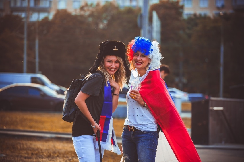 Two football fans smiling